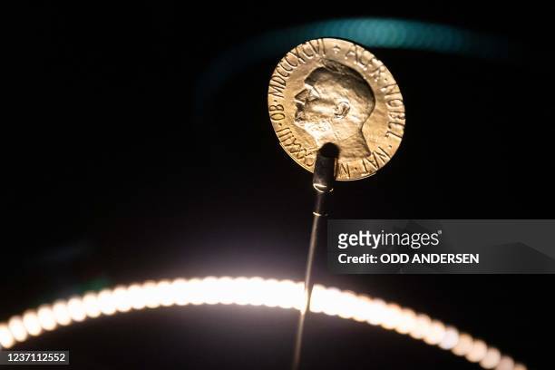 An official Nobel Peace Prize gold medal is seen at the exhibition at the Nobel Peace Center in Oslo on December 9 on the eve of the Nobel Peace...