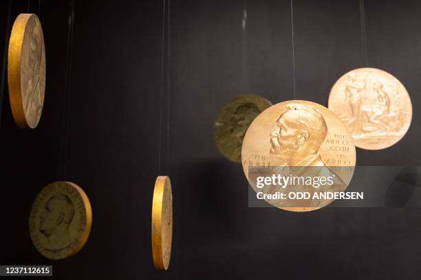 Replicas of the official Nobel Peace Prize gold medal are seen at the exhibition at the Nobel Peace Center in Oslo on December 9 on the eve of the...