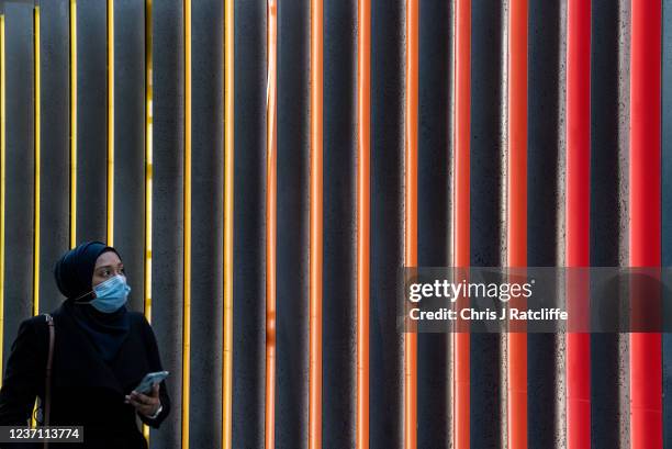 Commuters in the city of London during the morning rush hour on December 9, 2021 in London, England. Last night, the British prime minister announced...