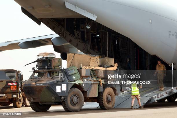 This photograph taken on December 5, 2021 shows a French Air Force Airbus A-400 M Atlas waiting to be loaded with vehicles and soldiers at the French...