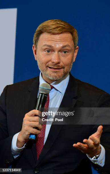 Germany's new Finance Minister Christian Lindner delivers a speech during the official transition of posts following yesterday's swearing in of the...