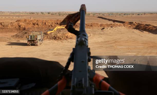 This photograph taken on December 7, 2021 shows a gun machine over the Menaka camp for the new Task Force Takuba, a multinational military mission in...