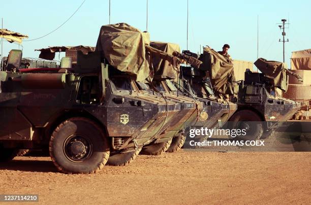 This photograph taken on December 7, 2021 shows French soldiers preparing armoured vehicles as France-led special operations for the new Task Force...