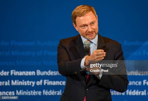 Germany's new Finance Minister Christian Lindner delivers a speech during the official transition of posts following yesterday's swearing in of the...