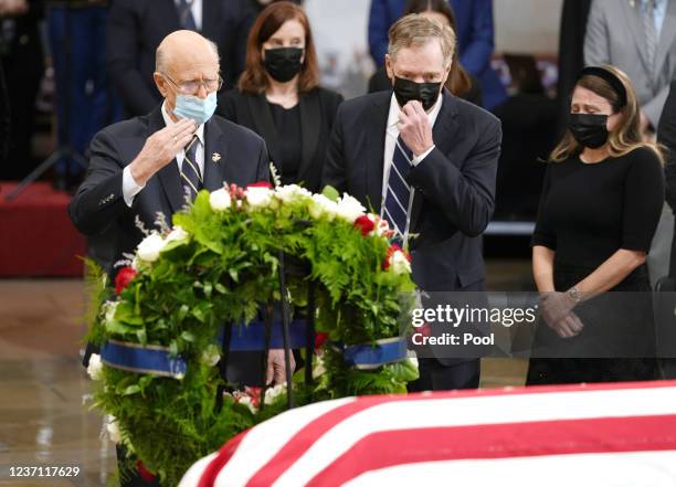 Former Senator Pat Roberts and former ambassador Robert Lighthizer pay their respects to former Senator Bob Dole as he lies in state at the Rotunda...