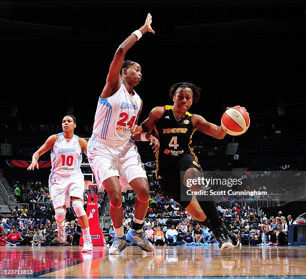 Amber Holt of the Tulsa Shock drives against Sandora Irvin of the Atlanta Dream at Philips Arena on September 4, 2011 in Atlanta, Georgia. NOTE TO...