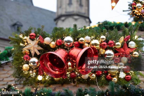 Christmas decoration at the Bonn Christmas market. Bells and Christmas balls on a sales booth on December 09, 2021 in Bonn, Germany.