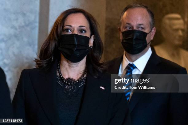 Vice President Kamala Harris and second gentleman Doug Emhoff are seen in the U.S. Capitol after a ceremony for the late Sen. Bob Dole, R-Kan., on...