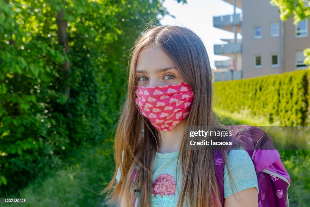 School girl with homemade protective mask