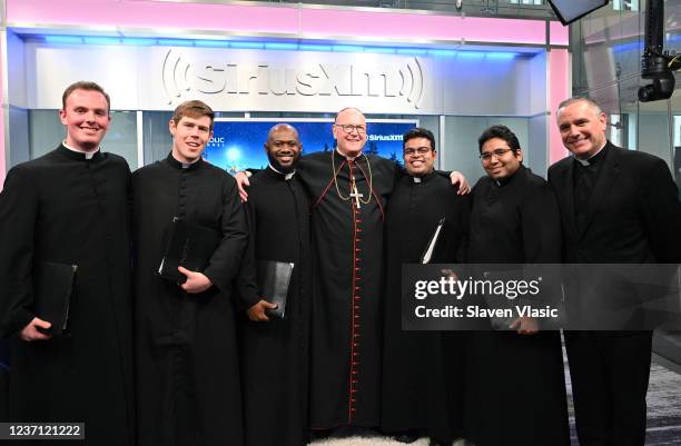 Cardinal Timothy Dolan C), Father Dave Dwyer with members of St. Joseph's Seminary The Schola Cantorum attend Cardinal Dolan's Annual SiriusXM...