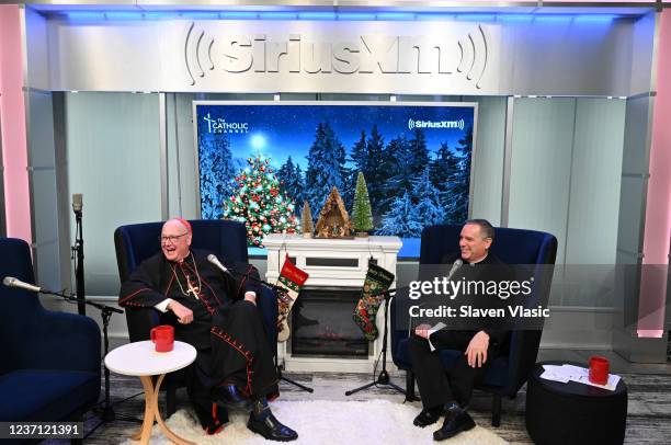 Cardinal Timothy Dolan and Father Dave Dwyer host Cardinal Dolan's Annual SiriusXM Christmas Special On The Catholic Channel at SiriusXM Studios on...