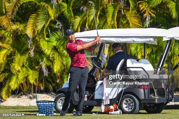 Tournament host Tiger Woods hits wedges on the practice range during the final round of the Hero World Challenge at Albany on December 5 in Nassau,...