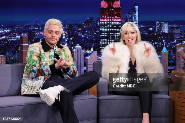 Episode 1568 -- Pictured: Actor Pete Davidson and singer Miley Cyrus during an interview on Thursday, December 9, 2021 --