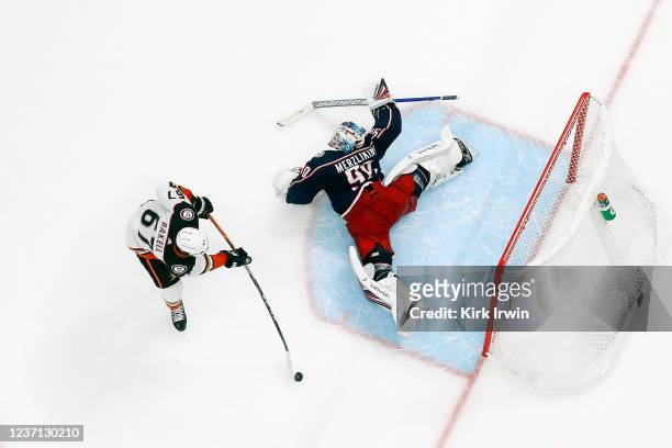 Rickard Rakell of the Anaheim Ducks beats Elvis Merzlikins of the Columbus Blue Jackets for the game-winning goal during a shootout at Nationwide...