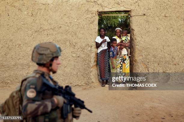 A French soldier patrols the streets of Gao on December 4, 2021. - France's anti-jihadist military force in the Sahel region, which today involves...