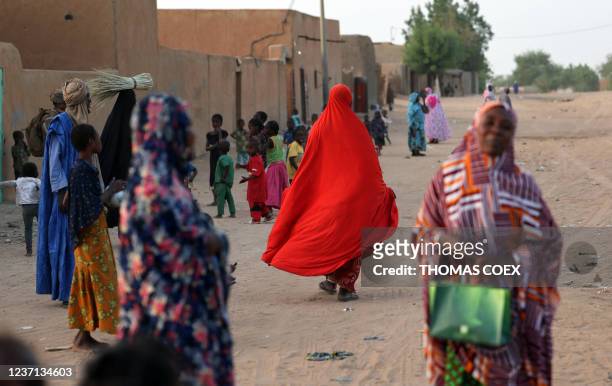 Locals walk the streets of Gao on December 4, 2021. France's anti-jihadist military force in the Sahel region, which today involves over 5,000...
