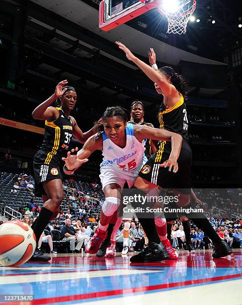 Angel McCoughtry of the Atlanta Dream battles for a loose ball against the Tulsa Shock at Philips Arena on September 4, 2011 in Atlanta, Georgia....