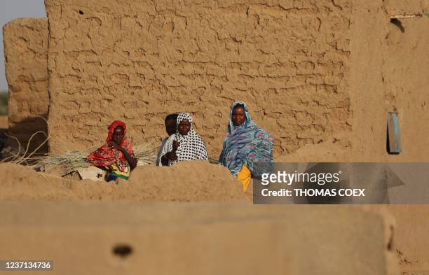 Mailan women look on in Gao on December 4, 2021. - France's anti-jihadist military force in the Sahel region, which today involves over 5,000 troops,...