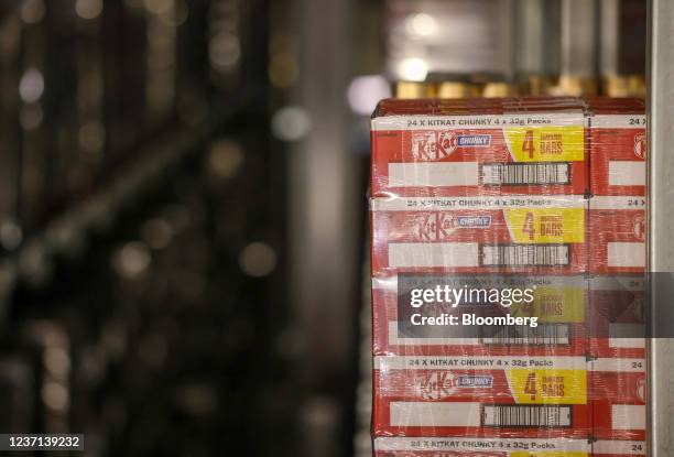 Pallet of KitKat chocolate bars, manufactured by Nestle SA on racking at a distribution warehouse operated by GXO Logistics Inc. Near Derby, U.K., on...