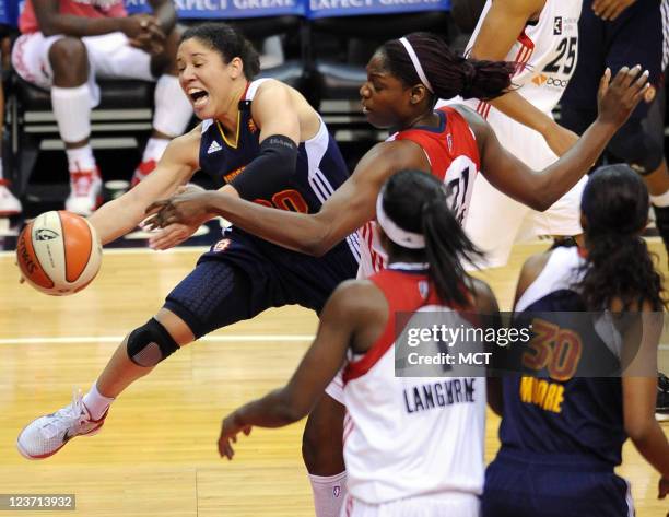 Connecticut Sun guard Kara Lawson gets fouled on a drive to the basket by Washington Mystics center Nicky Anosike during the third quarter at the...