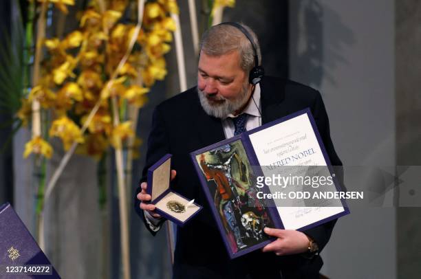 Nobel Peace Prize laureate Dmitry Muratov of Russia poses with the Nobel Peace Prize diploma and medal during the gala award ceremony for the Nobel...