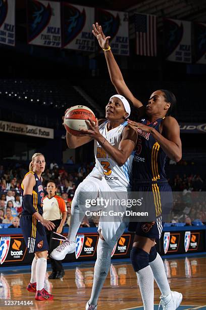 Dominique Canty of the Chicago Sky goes to the basket past Tangela Smith of the Indiana Fever during the WNBA game on September 4, 2011 at the...