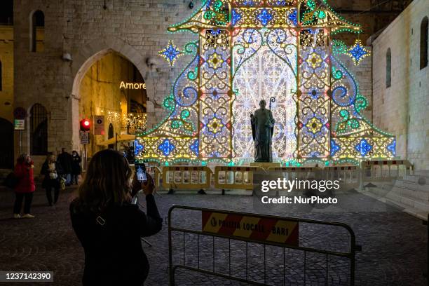 Lighting dedicated to the statue of San Nicola in front of the Basilica of San Nicola in Bari on December 9, 2021. Despite the pandemic, the...