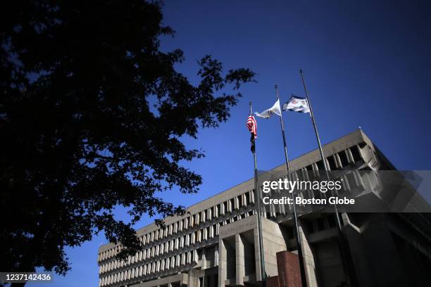 Boston, MA Flags fly above Boston City Hall on November 11, 2021.