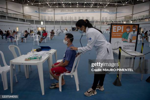 Patient gets medical treatment at the Health Care Center specialized in Flu and COVID-19 located at the Rio 2016's Olympic Park in Barra da Tijuca...