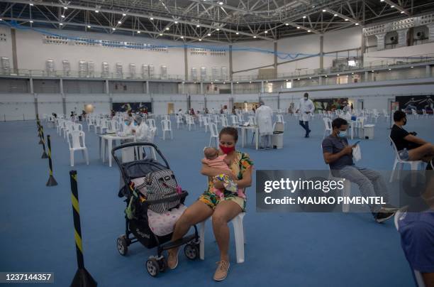 Patients await medical treatment at the Health Care Center specialized in Flu and COVID-19 located at the Rio 2016's Olympic Park in Barra da Tijuca...