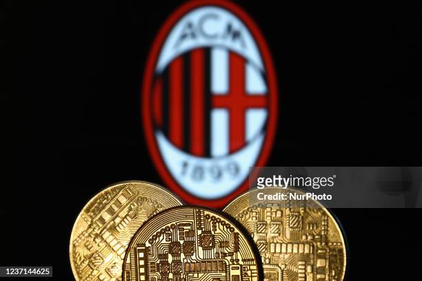 Representation of cryptocurrency is seen with AC Milan football club logo displayed in the background in this illustration photo taken in Krakow,...