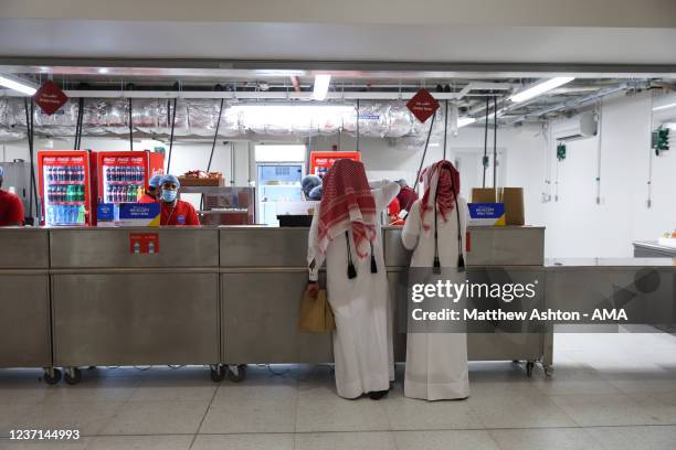 General internal view of fans order food and drink at a food vendor in the concourse at Al Bayt Stadium, host venue for the 2022 FIFA World Cup Qatar...