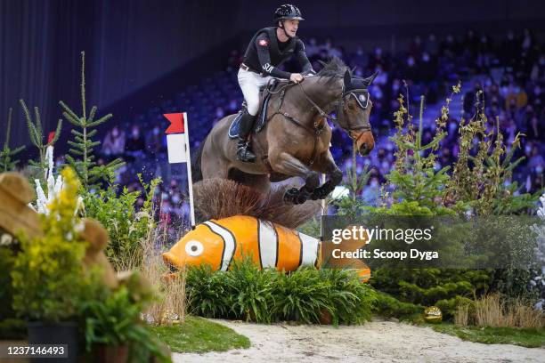 Robin Godel of Switzerland riding Grandeur de Lully CH during the CHI de Geneva - Rolex Grand Slam of Show Jumping on December 10, 2021 in Geneva,...