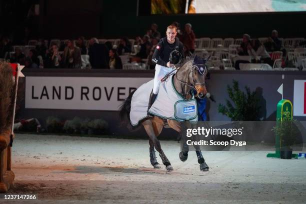 Robin Godel of Switzerland riding Grandeur de Lully CH during the CHI de Geneva - Rolex Grand Slam of Show Jumping on December 10, 2021 in Geneva,...