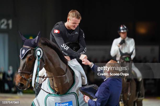 Robin Godel of Switzerland riding Grandeur de Lully CH during the CHI de Geneva - Rolex Grand Slam of Show Jumping on December 10, 2021 in Geneva,...