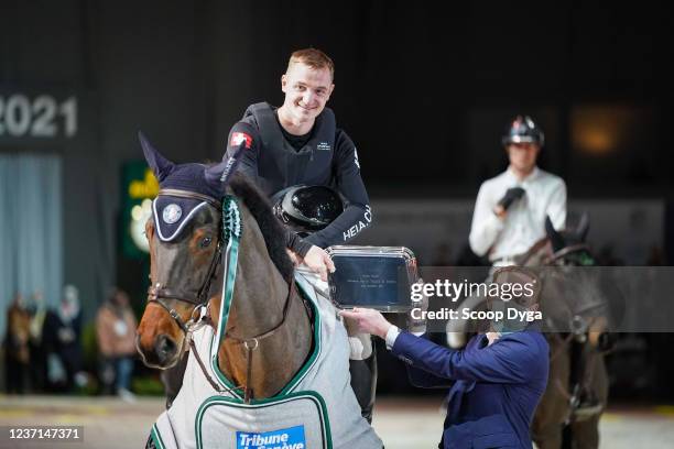 Robin Godel of Switzerland riding Grandeur de Lully CH during the CHI de Geneva - Rolex Grand Slam of Show Jumping on December 10, 2021 in Geneva,...