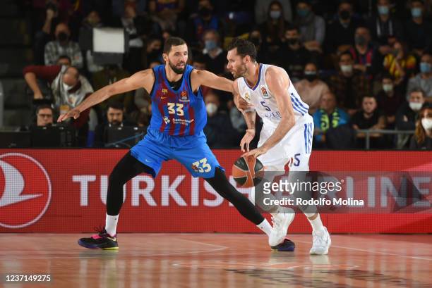 Rudy Fernandez, #5 of Real Madrid competes with Nikola Mirotic, #33 of FC Barcelona during the Turkish Airlines EuroLeague Regular Season Round 14...