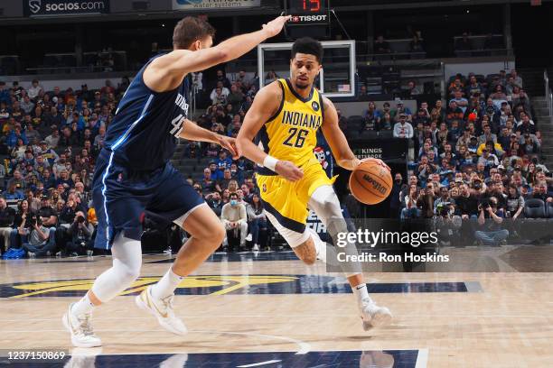 Jeremy Lamb of the Indiana Pacers drives to the basket during the game against the Dallas Mavericks on December 10, 2021 at Gainbridge Fieldhouse in...