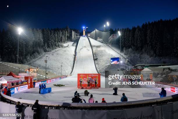 Second placed Norway's Silje Opseth, winner Austria's Marita Kramer and third placed Slovenia's Ursa Bogataj pose on the podium in the finish area...