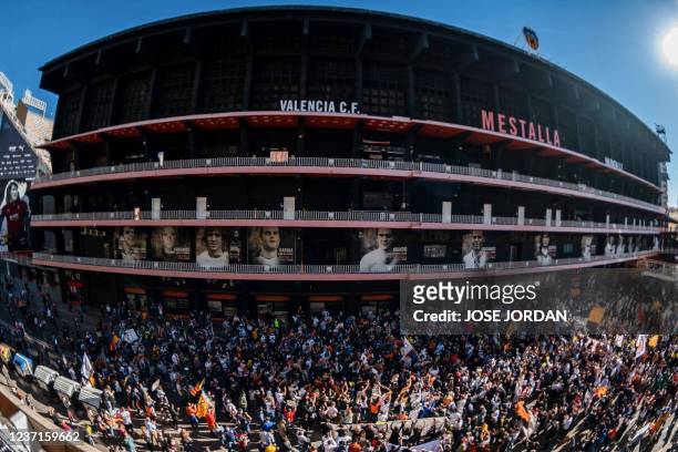 Valencia football club supporters take part in a protest against Singaporean business magnate and owner of the club Peter Lim outside the Mestalla...