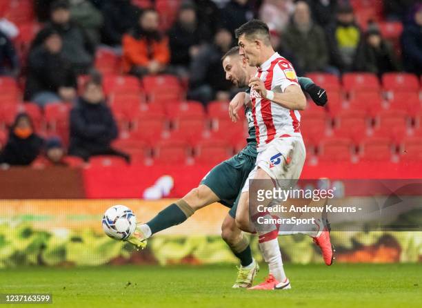 Middlesbrough's Andraz Sporar shoots at goal under pressure from Stoke City's Danny Batth during the Sky Bet Championship match between Stoke City...