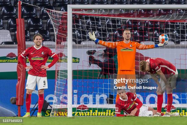 Lucas Hoeler of SC Freiburg, goalkeeper Mark Flekken of SC Freiburg, Janik Haberer of SC Freiburg and Philipp Lienhart of SC Freiburg looks dejected...