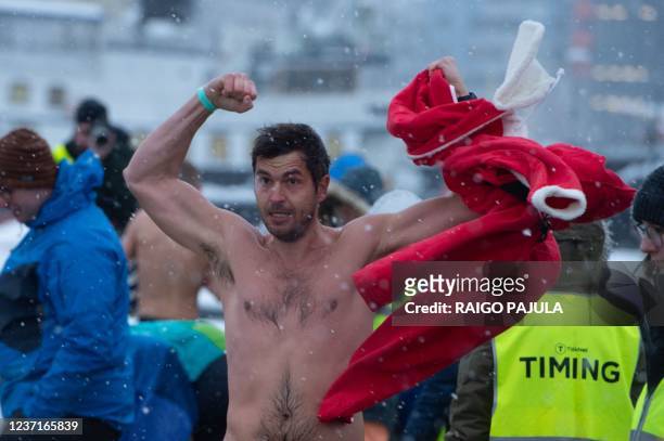 Swimmer Mirjo Koit from Estonia reacts after competing in the men's 25m competition of the Iceswim Festival 2021 in the Admiralty Inlet of the port...