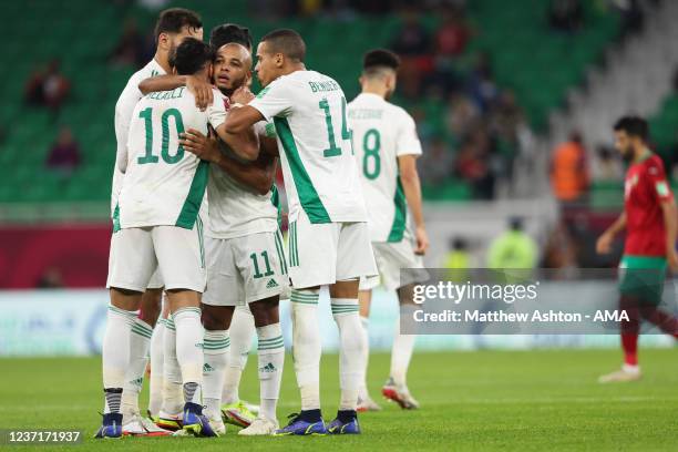 Yacine Brahimi of Algeria celebrates after scoring a goal to make it 0-1 during the FIFA Arab Cup Qatar 2021 Quarter-Final match between Morocco and...