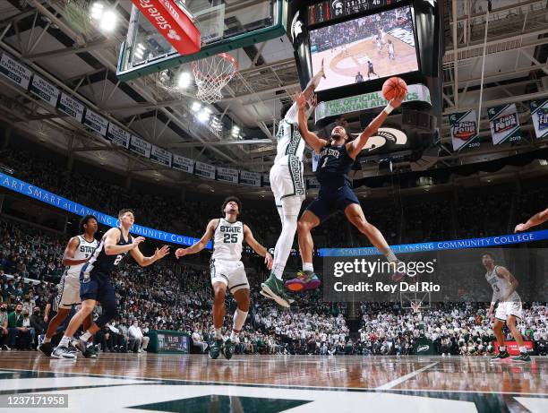 Seth Lundy of the Penn State Nittany Lions attempts to shoot over Marcus Bingham Jr. #30 of the Michigan State Spartans in the second half at Breslin...