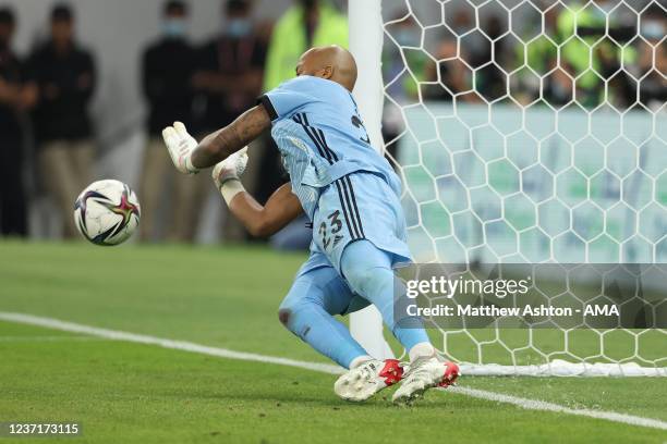 Rais Mbolhi of Algeria saves a penalty from Karim El Berkaoui of Morocco during the FIFA Arab Cup Qatar 2021 Quarter-Final match between Morocco and...