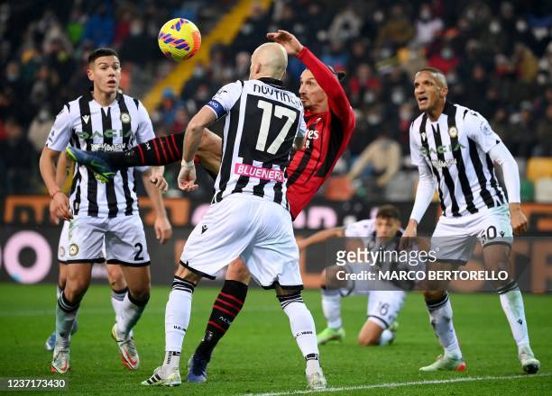 Milan's Swedish forward Zlatan Ibrahimovic shoots and scores a goal during the Italian Serie A football match between Udinese and AC Milan on...