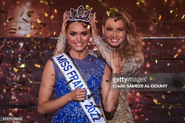 Miss Ile-de-France Diane Leyre is crowned by Miss France 2021 Amandine Petit at the end of the the Miss France 2022 beauty contest in Caen, on...