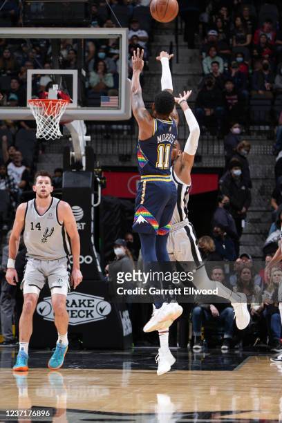Monte Morris of the Denver Nuggets shoots a three point basket buzzer beater at halftime during the game against the San Antonio Spurs on December...