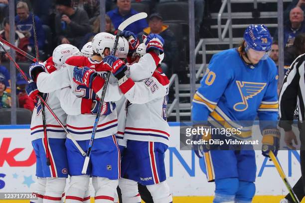 Members of the Montreal Canadiens celebrate after scoring a goal against the St. Louis Blues during the third period at Enterprise Center on December...